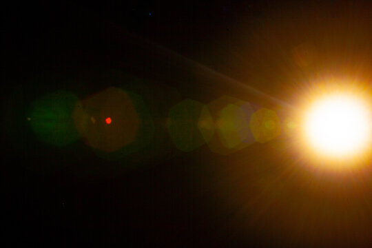 Sun flare on the black background