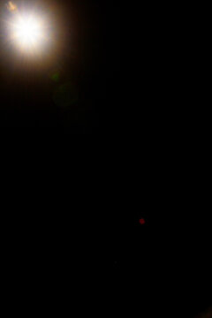 Sun flare on the black background