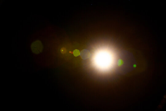 Sun flare on the black background