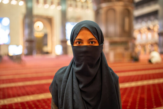 Muslim woman wearing niqab inside a mosque