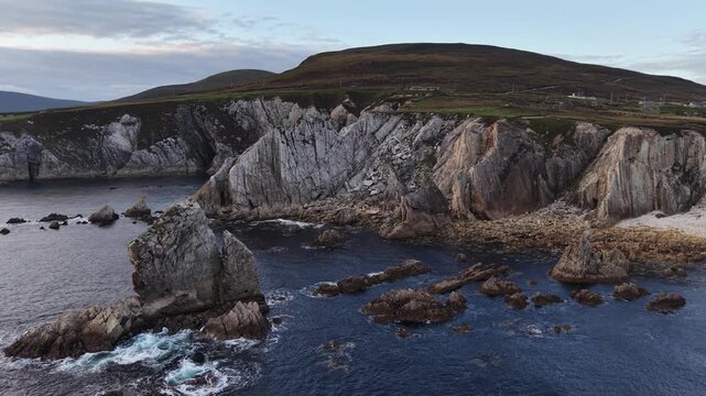 Cliffs and coastal scenery no action static scene, in coastal landscape with cliffs and water, with cliffs, water, sky, from a aerial or elevated perspective perspective, with blue, gray accents.