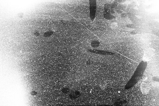 Vintage distressed old photo light leaks, film grain, dust and scratches transparent texture overlay with vignette border. Dirty grunge analog 8k widescreen retro effect background with copy space.