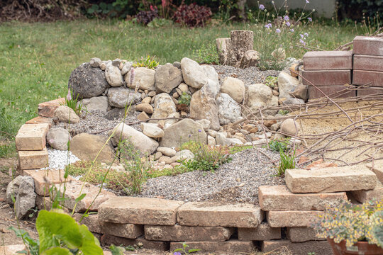 Calcareous grassland habitat with sandarium (habitat for ground-nesting wildbees). Natural sand, stony and woody material. Habitat typical food plants enhanceing the quality of the habitat.