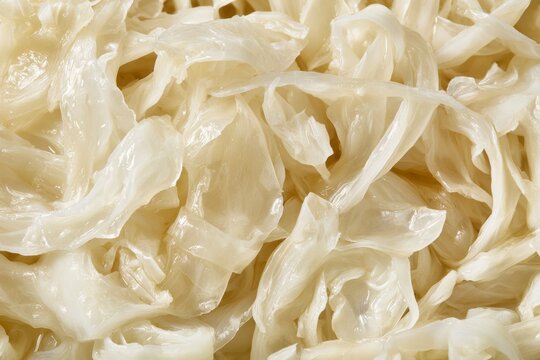 Fermented cabbage being prepared for dishes in a kitchen setting