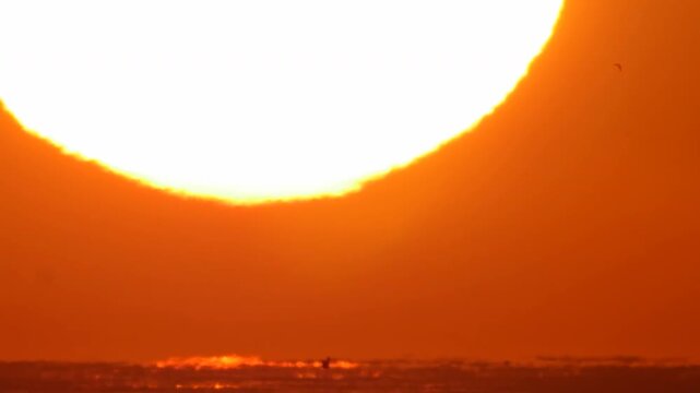 Close-up of the scorching sun during a heat wave, a symbol of the inevitable impact of climate change.