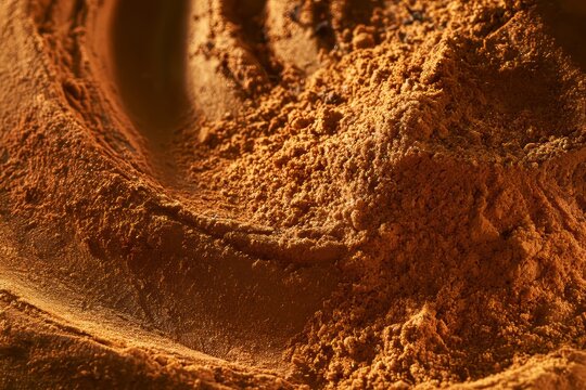 Close view of cocoa powder spread on a surface for baking tasks