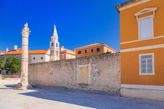 Historic roman column and church tower in Zadar, Dalmatia, Croatia