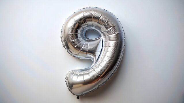Silver foil balloon number nine top view colored number on white background
