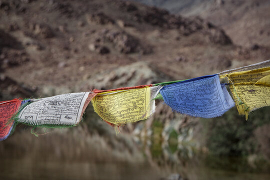 Close up of traditional Buddhist prayer flags with mantras in Ladakh Himalayas