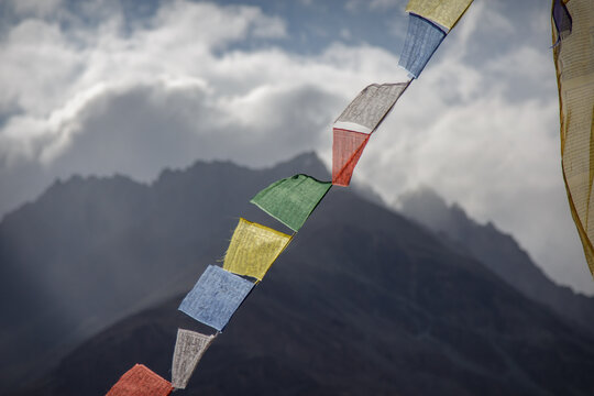 Colorful Tibetan prayer flags hanging on rope in Nubra Valley Ladakh