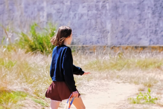 A young woman walking on the path