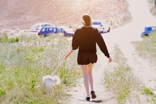 A young woman walking on the path