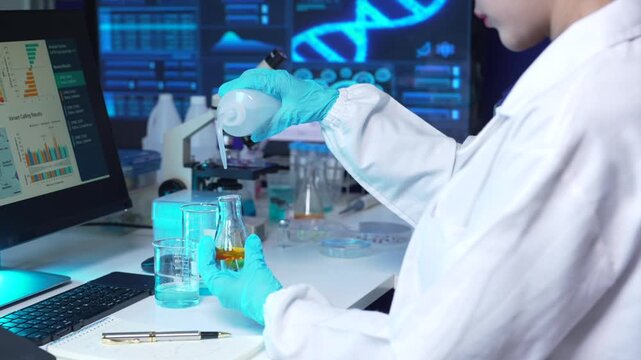 Lab work, scientists holds a test tube takes the test from a test tube in analysis for vaccine development.