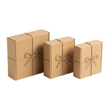 Three cardboard gift boxes of different sizes tied with twine isolated on transparent background