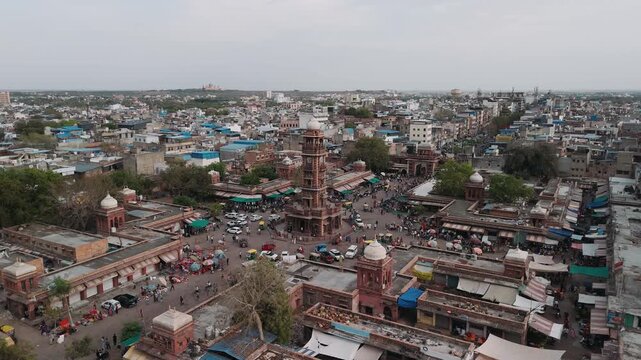Aerial view of ghanta ghar clock tower and sardar market in jodhpur, india with busy cityscape traffic