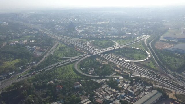 Aerial drone view of Tram 2 Interchange in Tang Nhon Phu Ward, Ho Chi Minh City, Vietnam, showing busy traffic at the intersection of National Highway 1A and the Eastern Ring Road.
