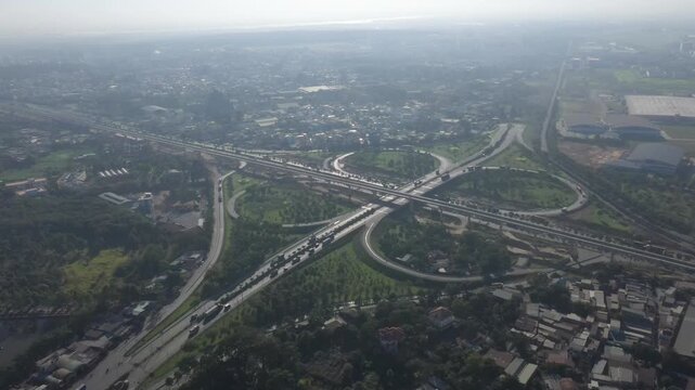 Aerial drone view of Tram 2 Interchange in Tang Nhon Phu Ward, Ho Chi Minh City, Vietnam, showing busy traffic at the intersection of National Highway 1A and the Eastern Ring Road.