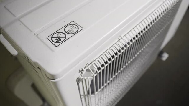 Outdoor Air Conditioning Unit with Safety Warning Signs