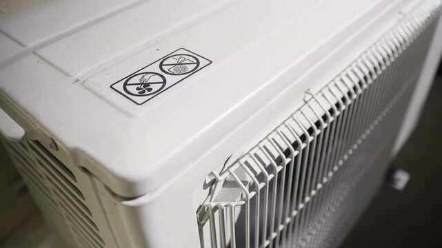 Outdoor Air Conditioning Unit with Safety Warning Signs