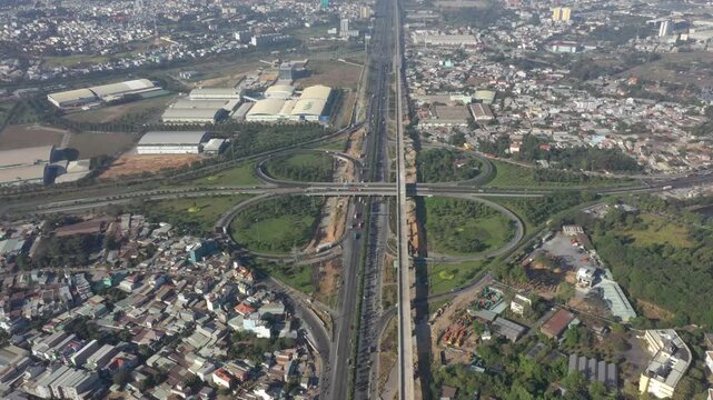 Aerial drone view of Tram 2 Interchange in Tang Nhon Phu Ward, Ho Chi Minh City, Vietnam, showing busy traffic at the intersection of National Highway 1A and the Eastern Ring Road.