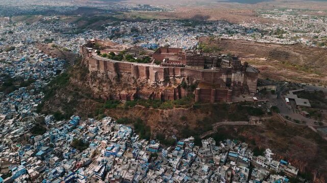 Aerial view of mehrangarh fort towering above the famous blue city of jodhpur, rajasthan, india