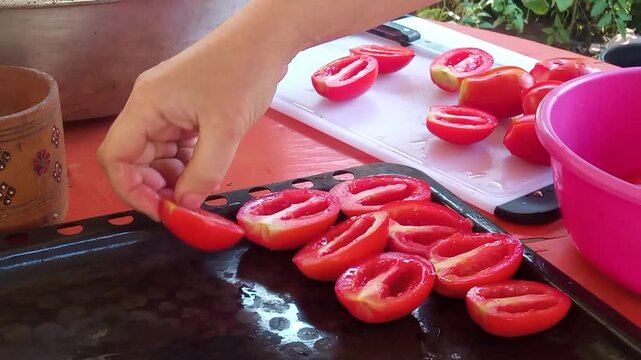 Process of preparing homemade sun-dried tomatoes in the kitchen, cooking video