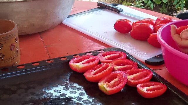 Process of preparing homemade sun-dried tomatoes in the kitchen, cooking video