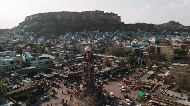 Aerial view of sardar market with ghanta ghar clock tower and mehrangarh fort in jodhpur, india, during daytime