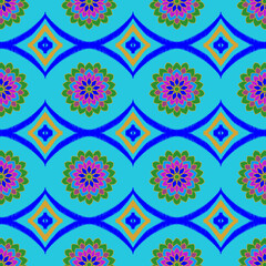 Vibrant blue seamless pattern with geometric diamond shapes and colorful mandala floral elements, ethnic textile vector design for fashion fabric and wallpaper background © Piyawan