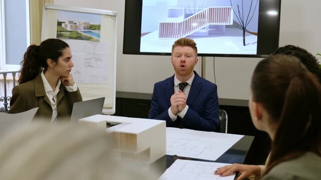 Team of architects and designers collaborating on a new architectural project in the boardroom