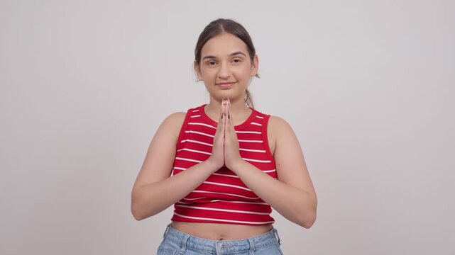 Indian Teenage Girl Greeting Namaste and Bowing