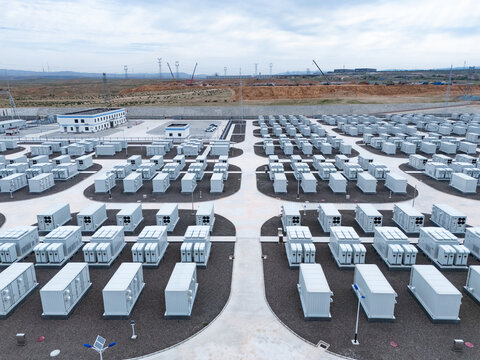 Neatly arranged array of energy storage battery packs outdoors