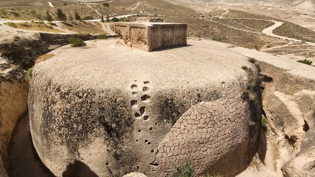 Takht-e Rostam ancient rock cut Buddhist stupa and monastery in Afghanistan. Ancient stone structure.