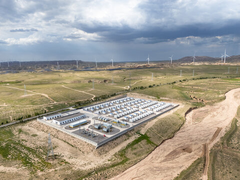 Wind power station and energy storage facilities in the desert landscape