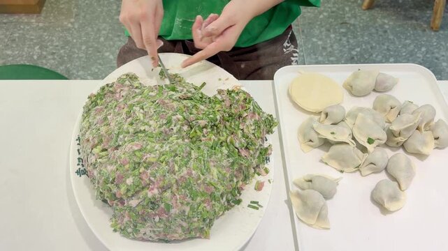 Hands Preparing Wontons and Dim Sum &ndash; Chinese Street Cafe Cooking