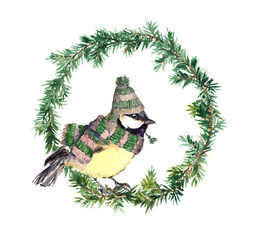 Watercolor chickadee in a striped hat and scarf centered within an evergreen wreath, isolated on white for Christmas stationery, wall art, labels, and seasonal decor. © zzorik