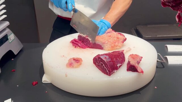 Chef Hands Thinly Slicing Marbled Beef and Plating for Hot Pot &ndash; Preparing Premium Meat 