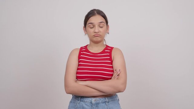 Disappointed Indian Teenage Girl Standing with Folded Hands