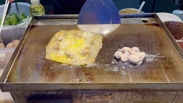 Korean Seafood Pancake &ndash; Oysters and Egg on Hot Plate Street Food