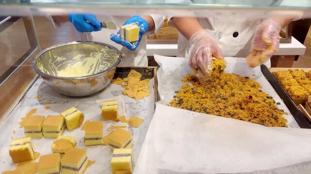 Chef Hands Making Traditional Chinese Flaky Pastry Squares with Sweet Filling and Crispy Coating &ndash; Handcrafted Bakery Preparation in Supermarket