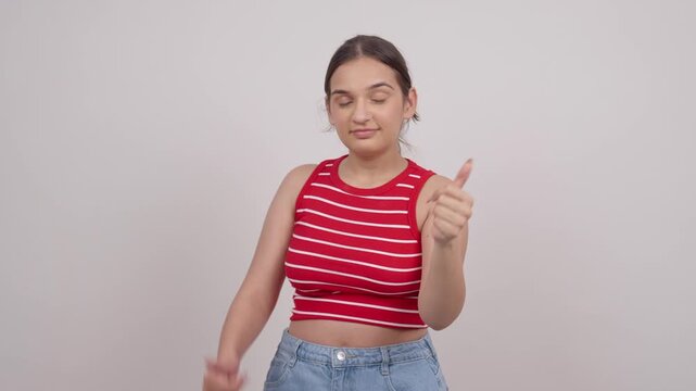 Indian Teenage Girl Pointing at Camera and Showing Thumbs Up, Motivating