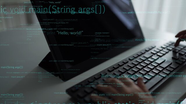 A focused programmer types code on a sleek keyboard while reviewing programming syntax on a monitor, emphasizing the essence of software development and technology. Xenic