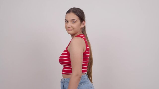 Indian Teenage Girl Turing Around and Looking at Camera