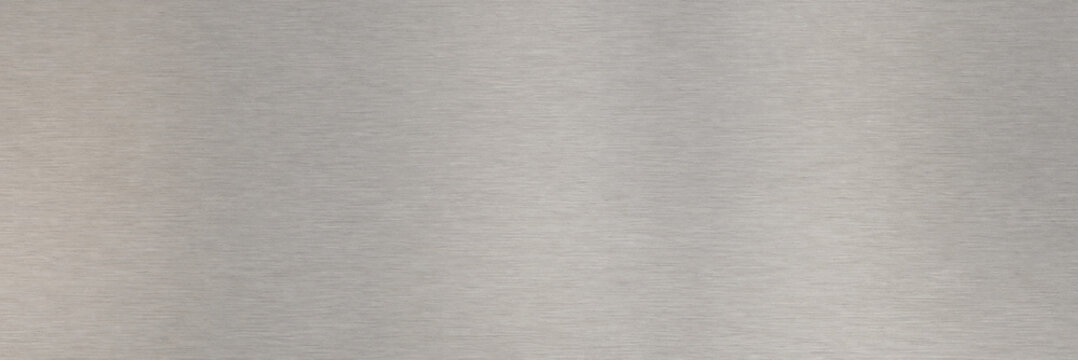 Brushed metal texture background, silver stainless steel surface with horizontal grain. Industrial aluminum metallic plate for modern architectural design, sleek gray iron backdrop.