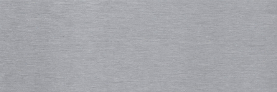 Brushed aluminum metal texture, silver stainless steel background, industrial metallic surface for architectural design and product mockups