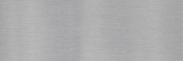 Fototapeta premium Brushed aluminum metal texture background, horizontal silver stainless steel surface with fine grain, industrial metallic plate backdrop for modern web design and product photography.