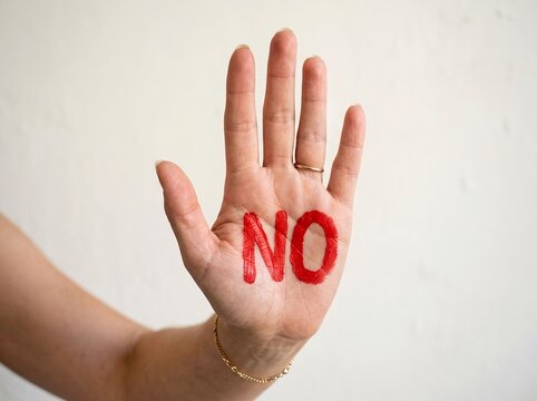 Open Palm with NO Message Representing Refusal and Personal Boundaries. Refusal, rejection, personal boundaries, consent, and assertive communication. Protection, prevention, disagreement, independent