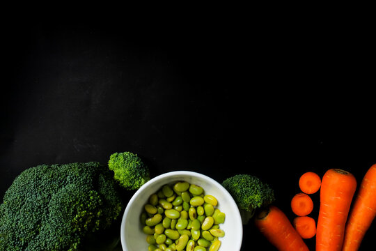 top view of fresh vegetables with cooy space on a black background