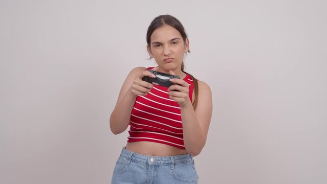 Serious Indian Teenage Girl Playing Game with Controller