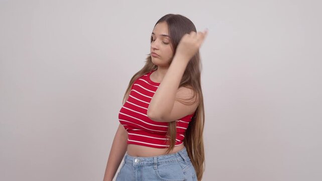 Indian Teenage Girl Combing her Hair
